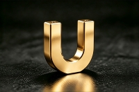 Close‑up of gold plated CNC machined component, electroplated gold surface treatment for electrical contacts and RF connectors